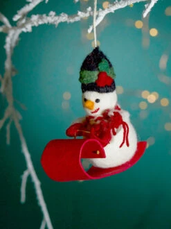 Sledding Snowman Christmas Ornament